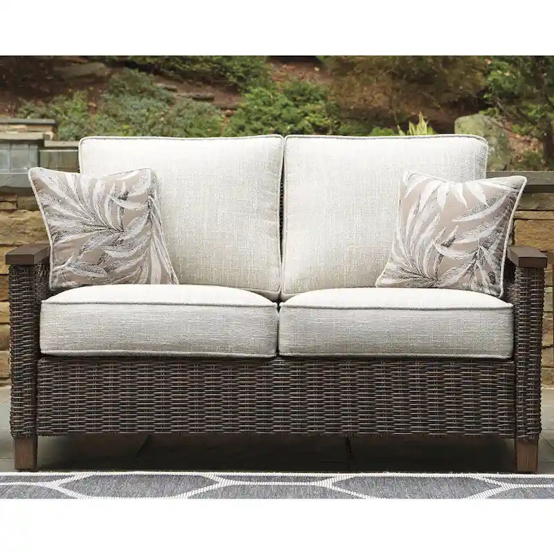 Signature Design by Ashley Paradise Trail Medium Brown/Beige Outdoor Loveseat, Lounge Chairs and Fire Pit Table