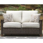 Signature Design by Ashley Paradise Trail Medium Brown/Beige Outdoor Loveseat, Lounge Chairs and Fire Pit Table